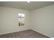 Simple bedroom with carpet flooring and a window at 1574 Jardine Loop, Little River, SC 29566