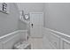 Bright entryway with white door, tile floor, and staircase at 1584 Swing Bridge Way, Myrtle Beach, SC 29588