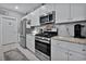 Stainless steel appliances and granite countertops in the kitchen at 1584 Swing Bridge Way, Myrtle Beach, SC 29588