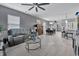 Open living and dining area with gray leather couches, and dining table at 1584 Swing Bridge Way, Myrtle Beach, SC 29588