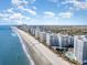 Aerial view of beachfront property with multiple high-rise buildings and ocean views at 161 Seawatch Dr. # 610, Myrtle Beach, SC 29572