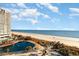 Aerial view of oceanfront property with pool at 161 Seawatch Dr. # 610, Myrtle Beach, SC 29572