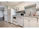 White kitchen with appliances and tile backsplash at 161 Seawatch Dr. # 610, Myrtle Beach, SC 29572