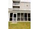 Building exterior showcasing a screened porch and second-story balcony at 1650 Deercreek Rd., Surfside Beach, SC 29575