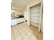 Kitchen with white cabinets, tile floor and large pantry at 1650 Deercreek Rd., Surfside Beach, SC 29575