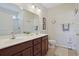 Double vanity bathroom with large mirror and shower at 169 Riverwatch Dr., Conway, SC 29527