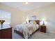 Cozy bedroom with full bed, nightstands, and window at 169 Riverwatch Dr., Conway, SC 29527