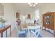 Bright dining room features a table with four chairs and a vintage china cabinet at 169 Riverwatch Dr., Conway, SC 29527