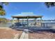 Peaceful lakeside gazebo with rocking chairs at 19 Cattail Ct. # 2B, Pawleys Island, SC 29585