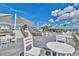 Relaxing outdoor seating area with shade and tables at 19 Cattail Ct. # 2B, Pawleys Island, SC 29585