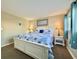 Bright bedroom with a queen-size bed and beach theme at 1906 S Ocean Blvd. # 108A, Myrtle Beach, SC 29577