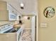 White kitchen with appliances and herringbone floor at 1906 S Ocean Blvd. # 108A, Myrtle Beach, SC 29577