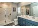 Bathroom with double vanity and walk-in shower at 2024 Willow Run Dr., Little River, SC 29566