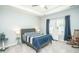 Bedroom with striped bedding and ceiling fan at 2024 Willow Run Dr., Little River, SC 29566