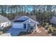 Nice two-story home with gray roof and light blue siding at 2024 Willow Run Dr., Little River, SC 29566