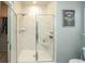 Large walk-in shower with marble tile and glass enclosure at 2024 Willow Run Dr., Little River, SC 29566