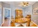 Bright dining room features a wood table and chairs, and built-in hutch at 204 Pipers Glenn # 204, Myrtle Beach, SC 29575