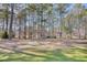 Condo building nestled among trees on a golf course at 204 Pipers Glenn # 204, Myrtle Beach, SC 29575