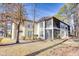 Back exterior view of condo showing a screened porch at 204 Pipers Glenn # 204, Myrtle Beach, SC 29575