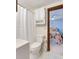 Clean bathroom with shower and toilet, plus view of bedroom at 205 56Th Ave. N, North Myrtle Beach, SC 29582