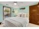 Calm bedroom with a queen-size bed and view of the pool at 205 56Th Ave. N, North Myrtle Beach, SC 29582