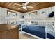 Bedroom with twin-over-twin bunk beds, wood ceiling, and ocean decor at 205 56Th Ave. N, North Myrtle Beach, SC 29582