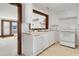 Bright white kitchen features wood countertops, modern appliances, and a pass-through to the dining area at 205 56Th Ave. N, North Myrtle Beach, SC 29582