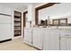 White kitchen with built-in shelving and stainless steel dishwasher at 205 56Th Ave. N, North Myrtle Beach, SC 29582