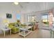 Beachy living room with light wood floors and green couch at 205 56Th Ave. N, North Myrtle Beach, SC 29582