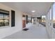 Front porch entry with orange door and white walls at 205 56Th Ave. N, North Myrtle Beach, SC 29582