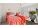 Two twin beds with coral bedding in a bright bedroom at 209 Hillside Dr. N # 204, North Myrtle Beach, SC 29582