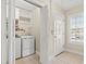 Stackable washer and dryer in a well-lit laundry room at 209 Hillside Dr. N # 204, North Myrtle Beach, SC 29582