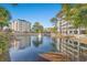 Community pond view with fountain and reflecting buildings at 209 Hillside Dr. N # 204, North Myrtle Beach, SC 29582