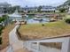 Waterfront backyard with walkway and dock access at 2228 Oyster Cove, Murrells Inlet, SC 29576