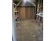 Unfinished basement storage area with shelving and workbench at 2228 Oyster Cove, Murrells Inlet, SC 29576