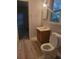 Simple bathroom with wood vanity and vinyl flooring at 2228 Oyster Cove, Murrells Inlet, SC 29576