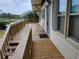 Wooden deck with stairs leading to the ground and seating for two at 2228 Oyster Cove, Murrells Inlet, SC 29576