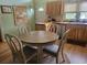 Round dining table with four chairs situated in a cozy kitchen area at 2228 Oyster Cove, Murrells Inlet, SC 29576