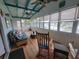 Relaxing sunroom with water views and rocking chairs at 2228 Oyster Cove, Murrells Inlet, SC 29576