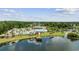 Aerial view of community pool, clubhouse, and lake, surrounded by lush landscaping at 2871 Ellesmere Circle, Myrtle Beach, SC 29579