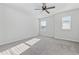 Well-lit bedroom with grey carpet and ceiling fan at 2871 Ellesmere Circle, Myrtle Beach, SC 29579