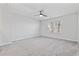 Bright bedroom featuring neutral carpeting, ceiling fan, and a large window at 2871 Ellesmere Circle, Myrtle Beach, SC 29579