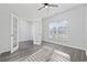 Inviting bedroom with stylish gray flooring, white trim, and a large window providing natural light at 2871 Ellesmere Circle, Myrtle Beach, SC 29579