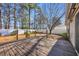 Spacious back deck overlooks fenced-in backyard with mature trees at 306 Andorra St., Longs, SC 29568