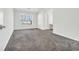 Primary bedroom with carpet flooring and a large window at 306 Andorra St., Longs, SC 29568