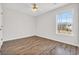 Well-lit bedroom with wood-look flooring and a window at 306 Andorra St., Longs, SC 29568