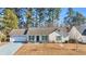 Ranch style home with attached garage and mature trees at 306 Andorra St., Longs, SC 29568