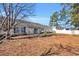 Back of house features a deck and a fenced-in yard at 306 Andorra St., Longs, SC 29568