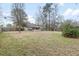 Large backyard with grassy area and wooden fence at 320 Muirfield Rd., Myrtle Beach, SC 29588