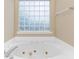 Bathroom with jetted tub and block window at 320 Muirfield Rd., Myrtle Beach, SC 29588